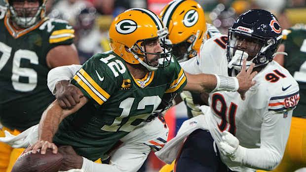 Green Bay Packers quarterback Aaron Rodgers (12) is sacked by Chicago Bears linebacker Robert Quinn. Nfl Chicago Bears At Green Bay Packers